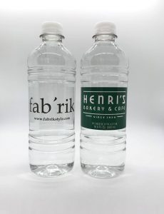 two water bottles affixed with custom promotional labels