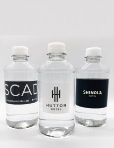 three water bottles with custom labels