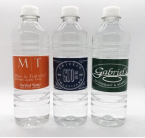 three plastic water bottles with personalized labels